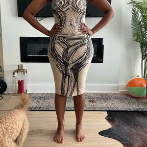 Long no sleeve black printed tan dress from Discovery